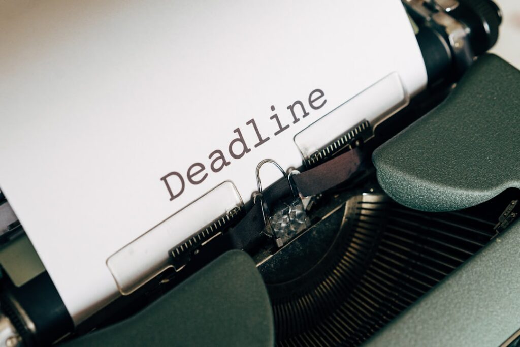 Calendar with a deadline marked next to a stack of overdue payment notices