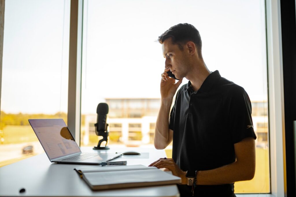 Small business owner on the phone discussing MCA debt relief options