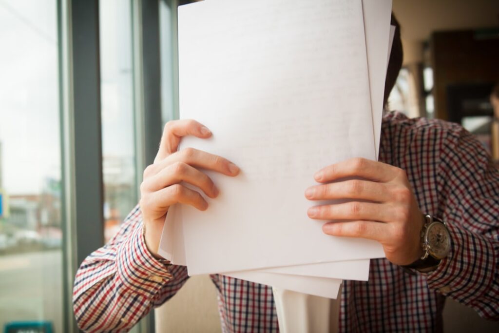 Person reviewing a personal credit report with a concerned expression