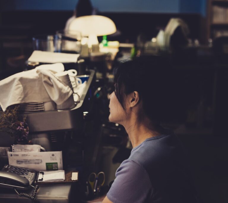Business owner reviewing a second financing contract late at night