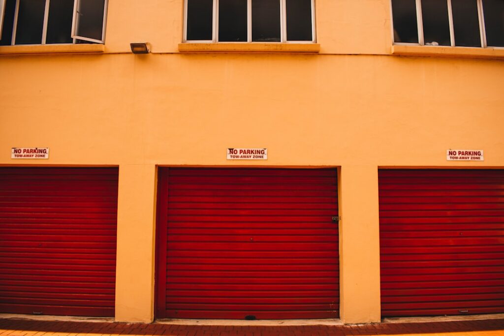 Rows of self-storage units with roll-up doors during a quiet fall afternoon