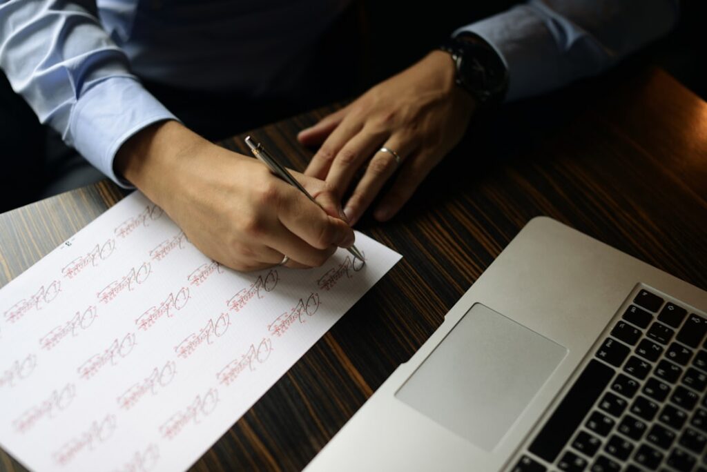 Close-up of a business contract clause being reviewed with a pen