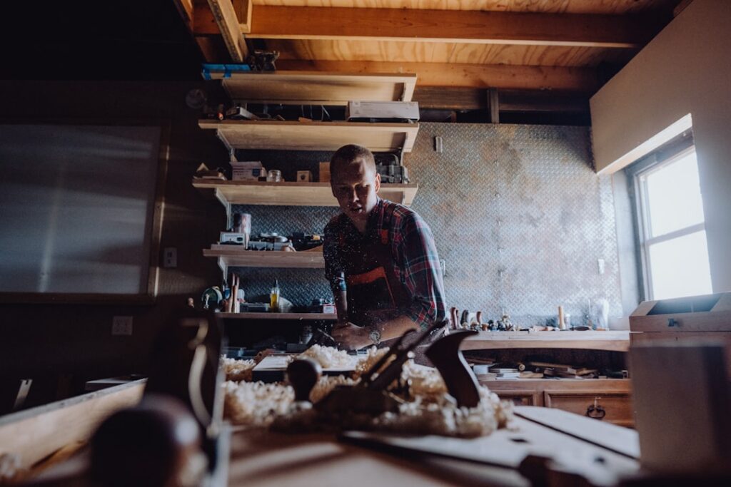Small business owner working during a busy day at the shop