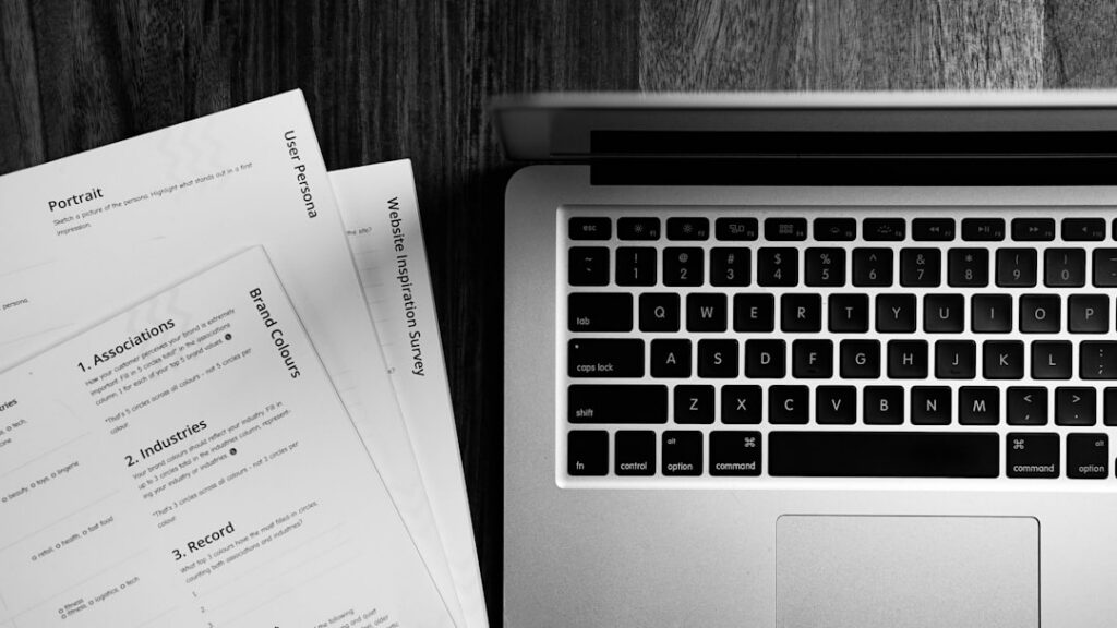 Gavel resting on legal documents beside a laptop, representing regulatory oversight