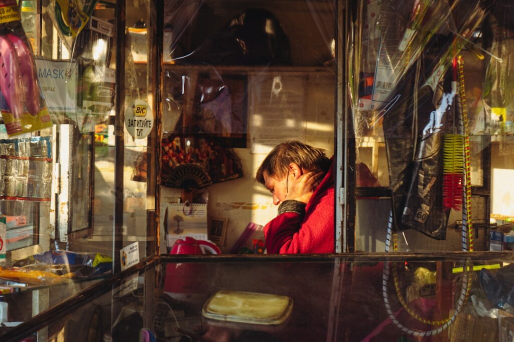 Small business owner reviewing a declined card payment terminal at the counter