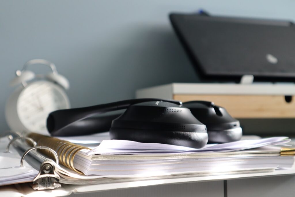 Stack of invoices and a calculator representing multiple stacked advance payments