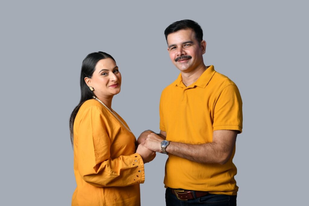 Business owner and specialist shaking hands over a settlement agreement