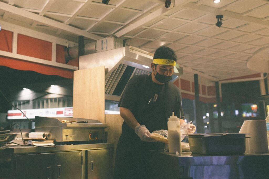 Food truck owner reviewing cash register receipts on a slow weekday