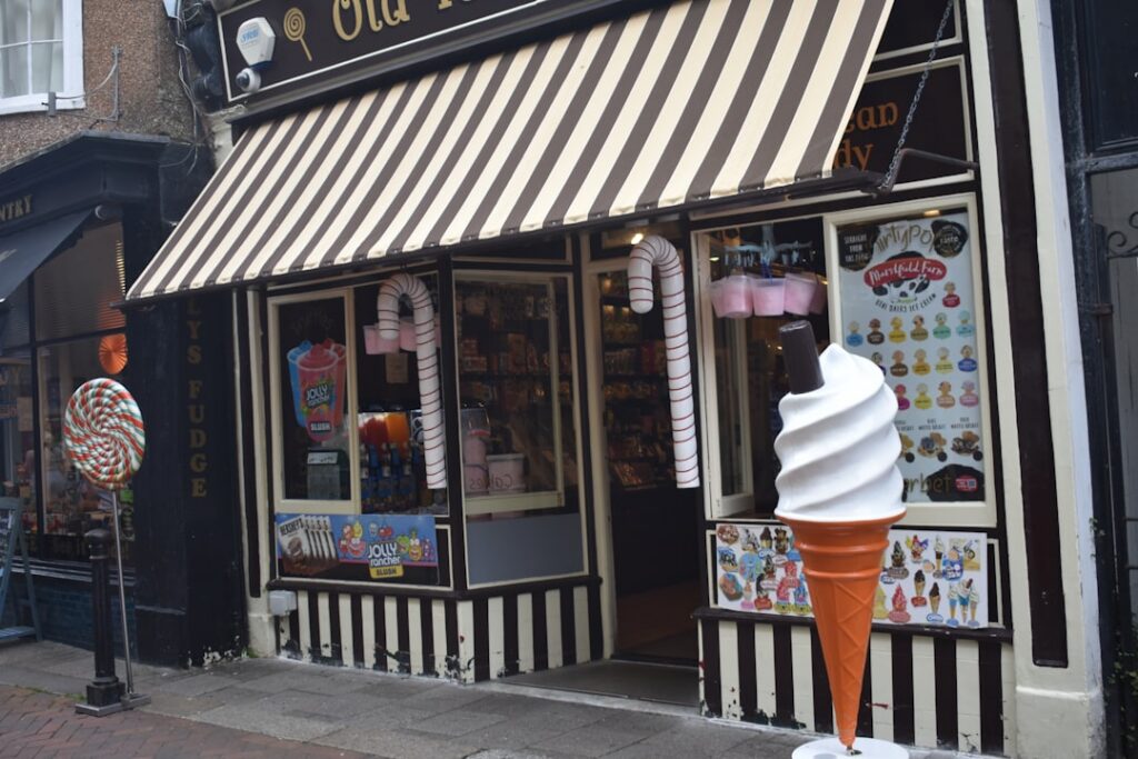 Ice cream shop owner locking up the counter after the summer rush ends