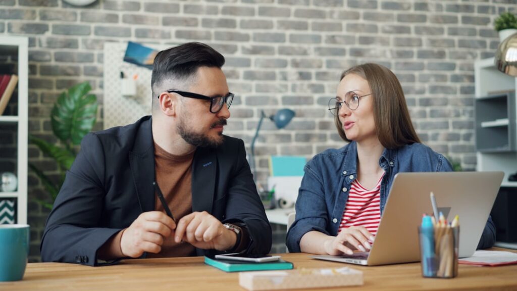 Handshake across a desk after a successful business negotiation