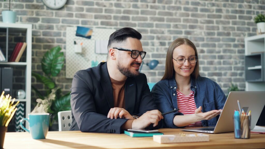 Buyer and seller signing a business purchase agreement