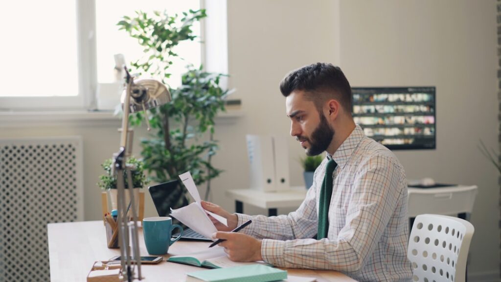 Business owner reviewing new LLC formation paperwork at a desk