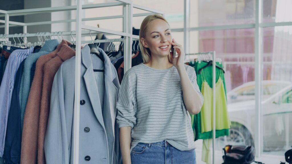 Small business owner smiling while on a phone call