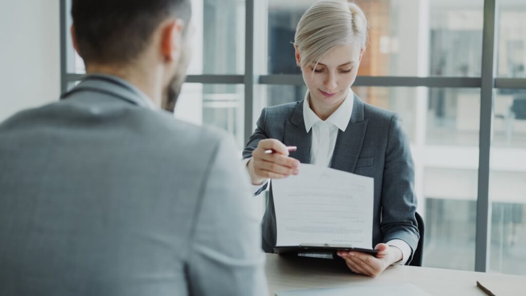 Business owner discussing a negotiated MCA settlement with a specialist