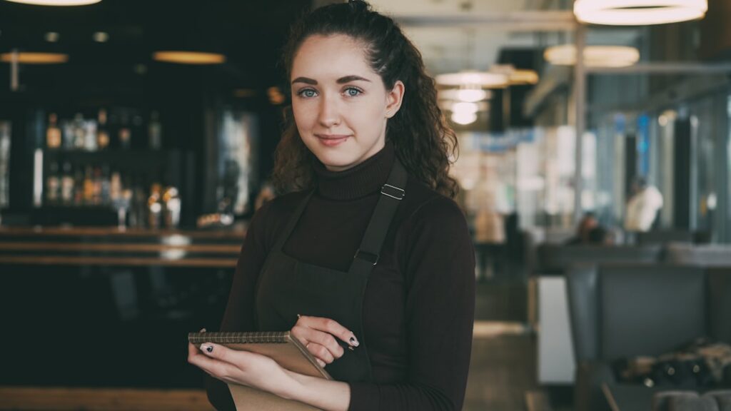 Restaurant owner filling out new business bank account paperwork