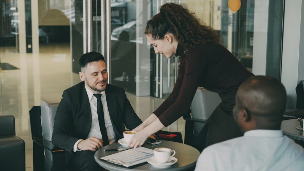 Business owner and advisor shaking hands after a negotiation meeting