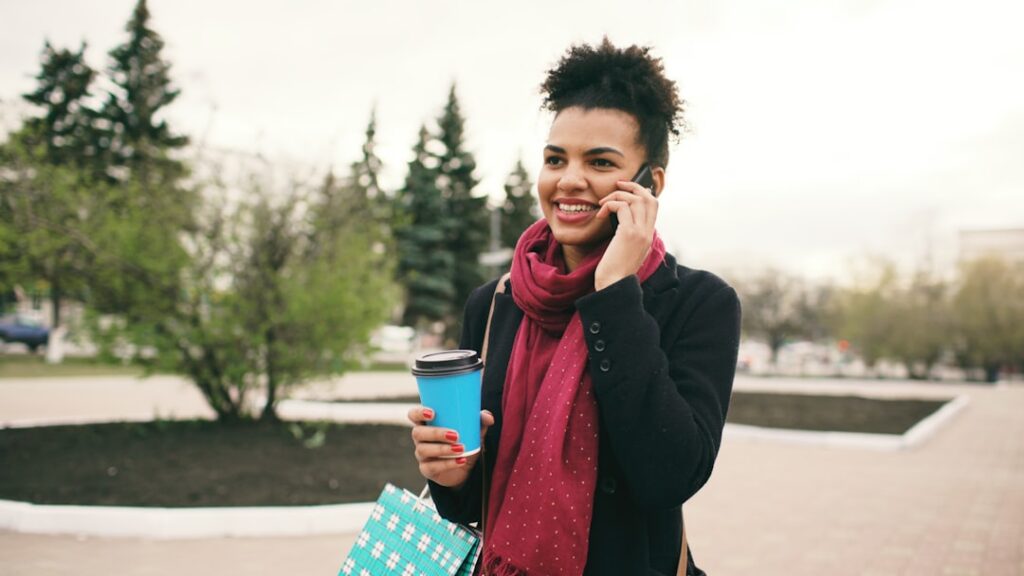 Business owner smiling during a phone call, looking relieved