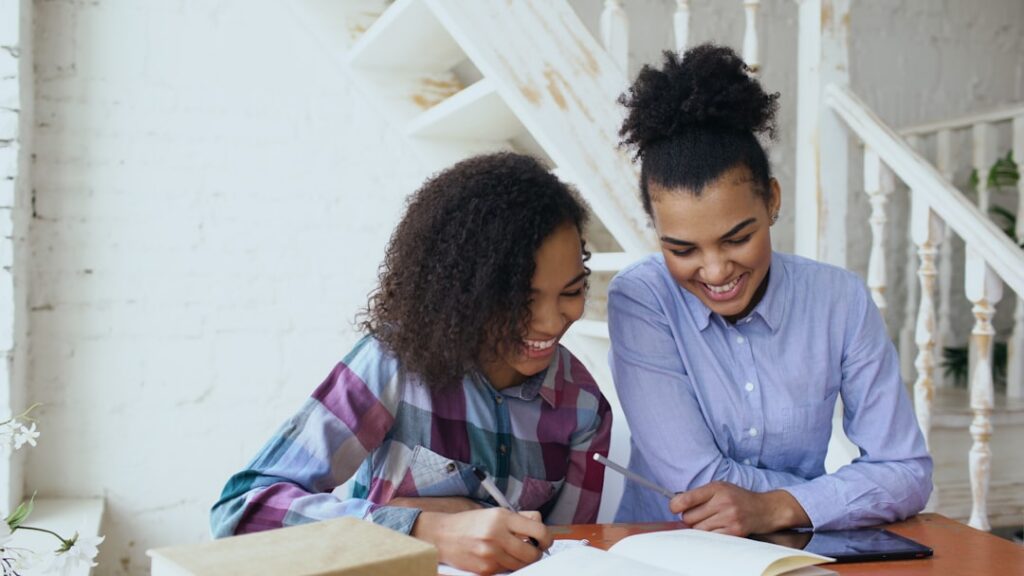Business owner and advisor reviewing settlement paperwork at a desk