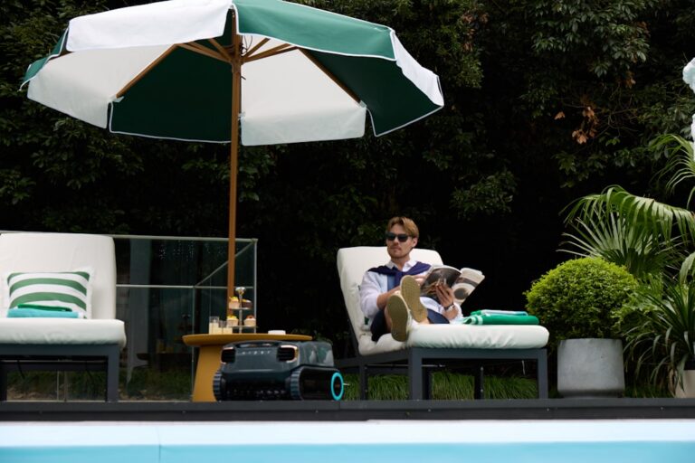 Pool service technician testing water chemistry at a residential pool during peak summer season