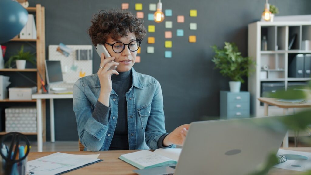 Business owner on a phone call taking notes