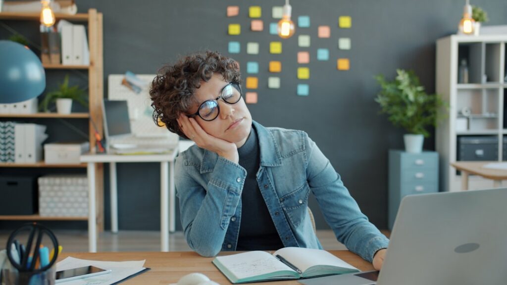 Small business owner reviewing a bank statement with a concerned expression