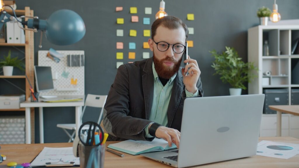 Business owner on a phone call discussing next steps for the business