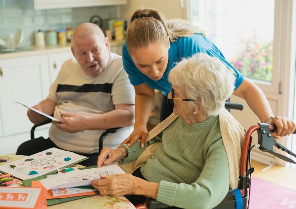 Home health nurse reviewing billing paperwork during a patient visit