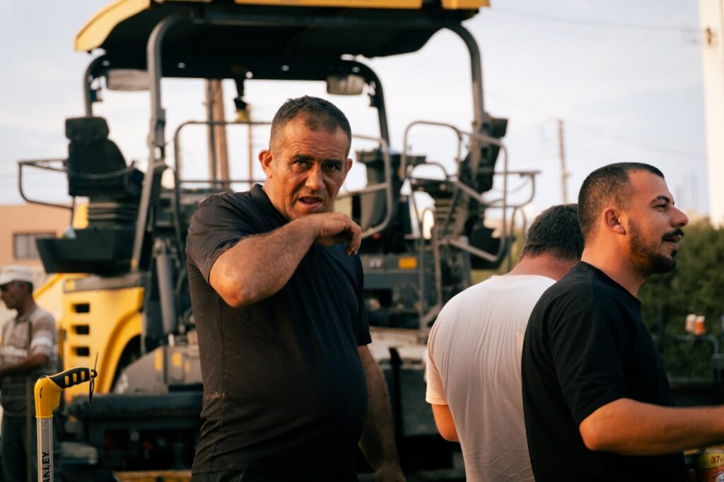 Contractor shaking hands after resolving a business debt settlement
