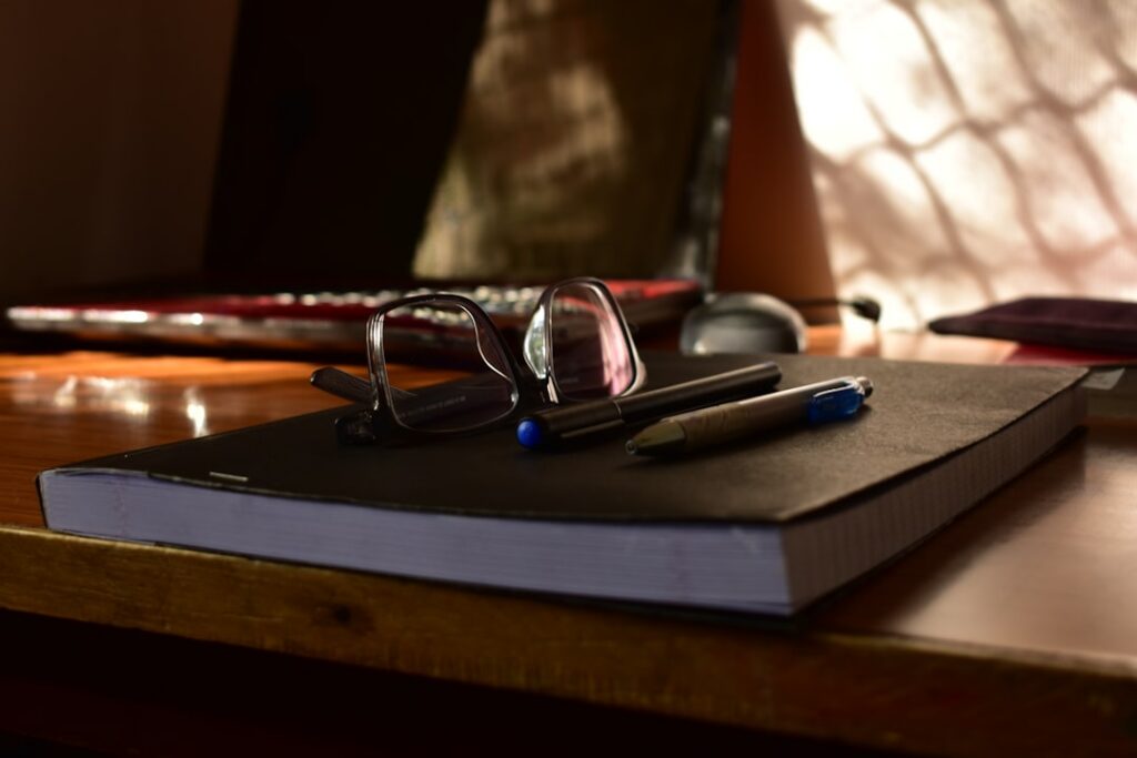 Business financing contract on a desk with reading glasses, close-up detail shot