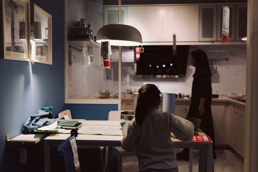 Small business owner reviewing a legal document at a kitchen table