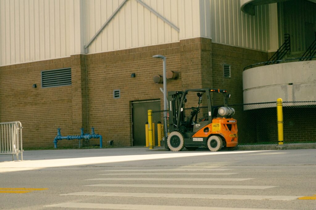 Contractor installing a security camera upgrade at a self-storage facility