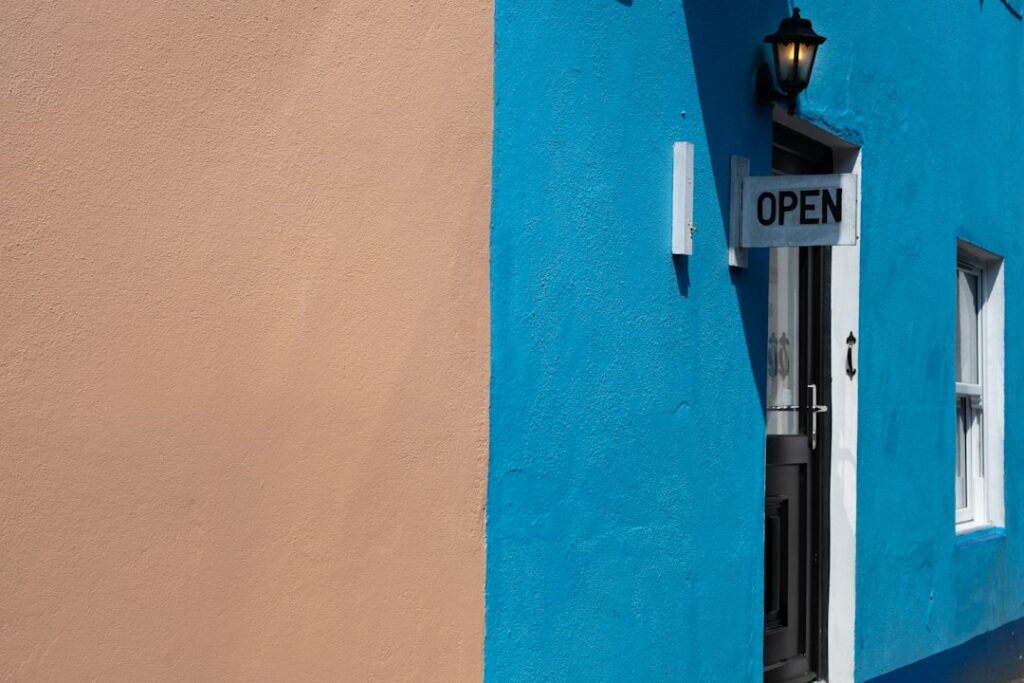 A closed sign hanging in the window of a small storefront