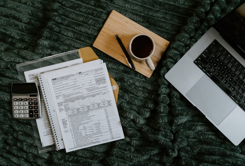 Business owner calculating cash flow across multiple accounts