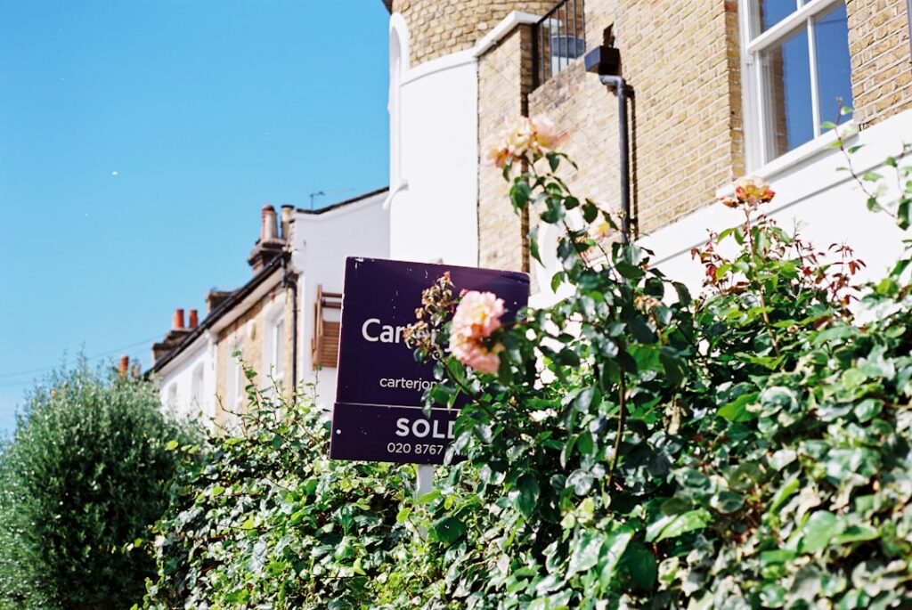 House for sale sign, representing a home sale blocked by a lien