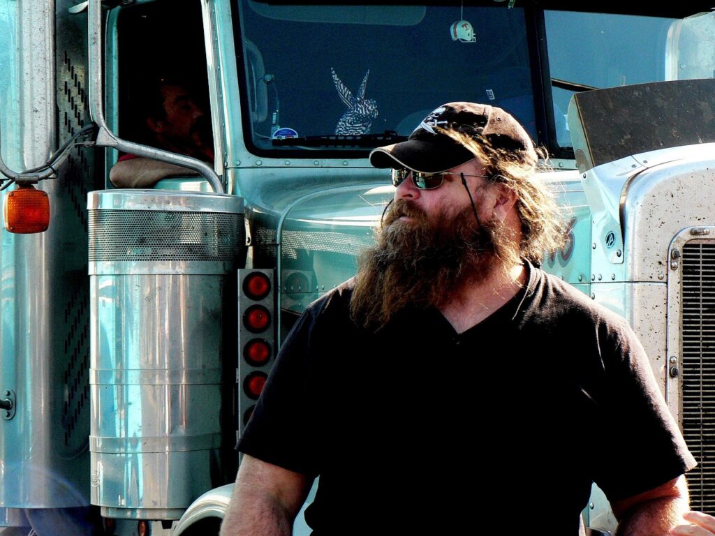 Truck driver reviewing paperwork at a freight dispatch office