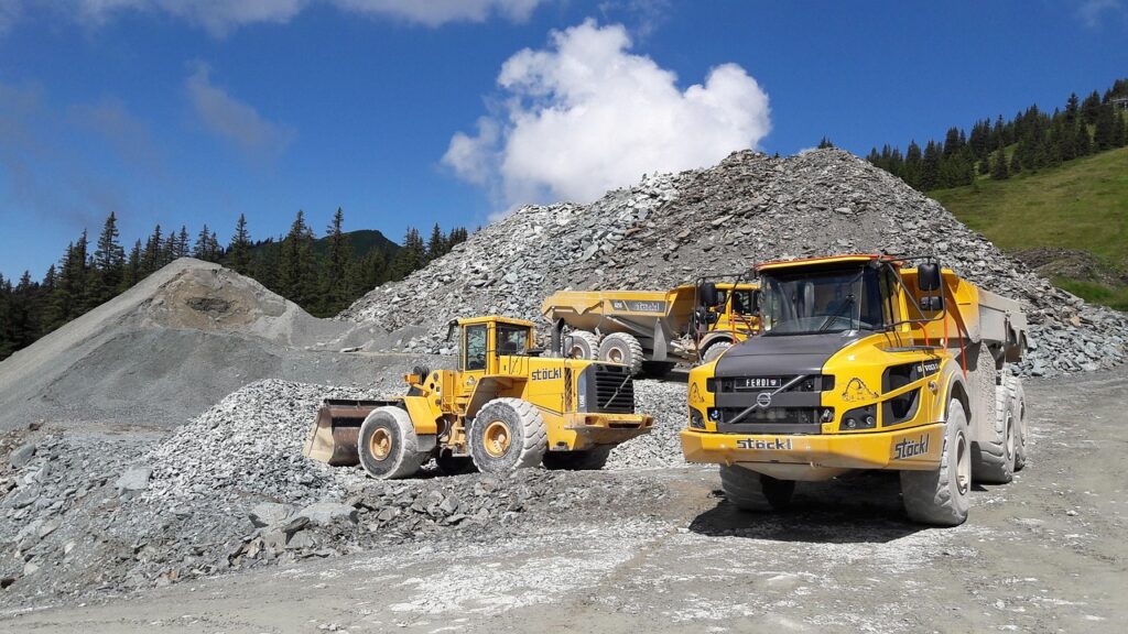 Contractor reviewing settlement paperwork beside a work truck