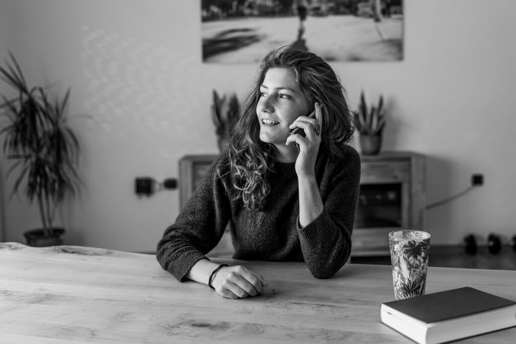 Business owner on a phone call discussing debt relief options