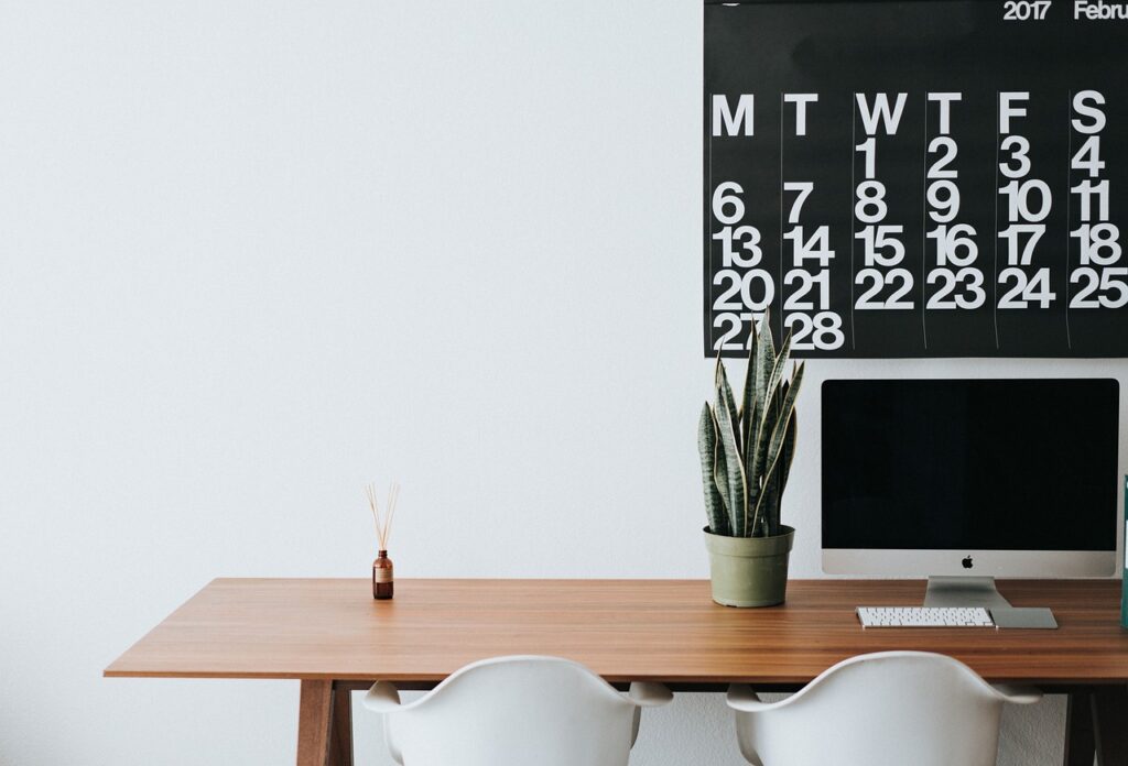 Tax refund check and business ledger paperwork on an office desk