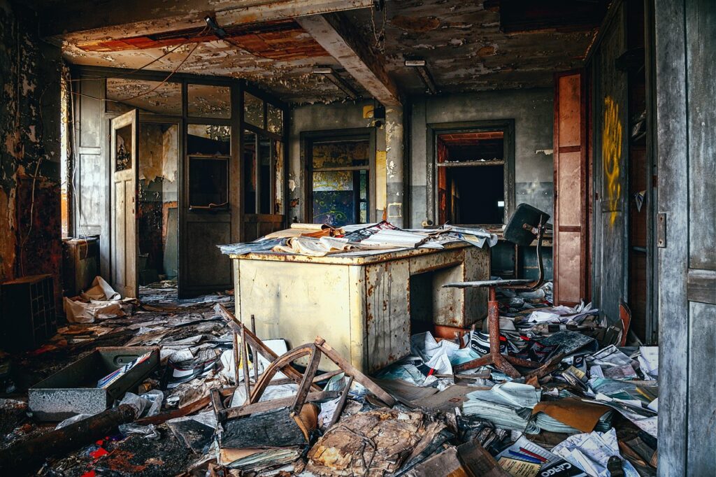 Payroll and tax paperwork spread on a small business office desk