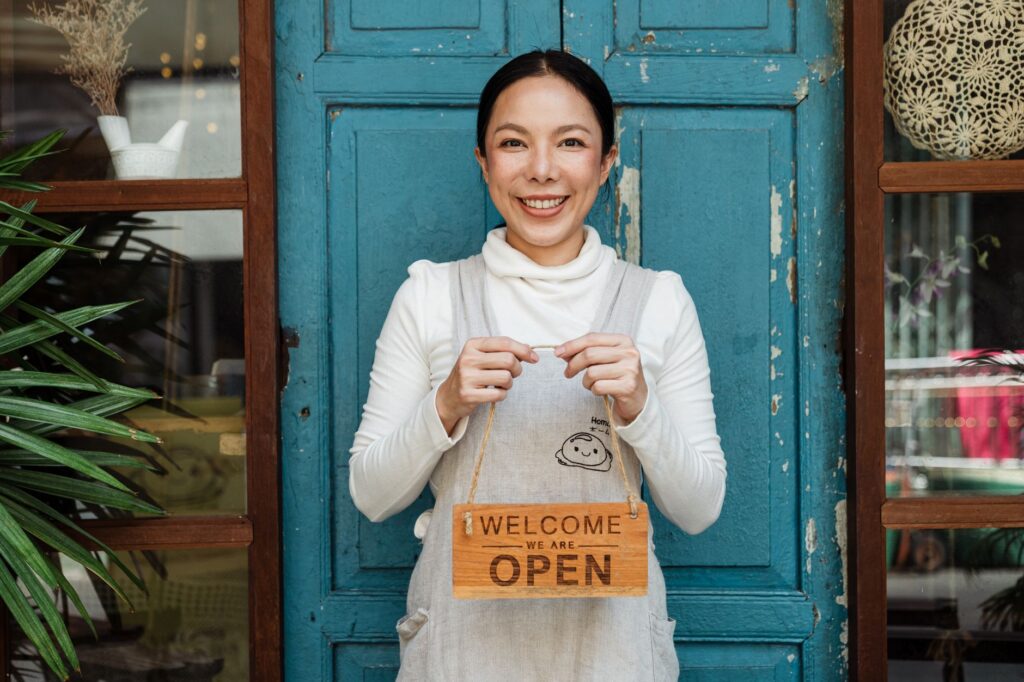 Bakery owner standing confidently in the kitchen doorway