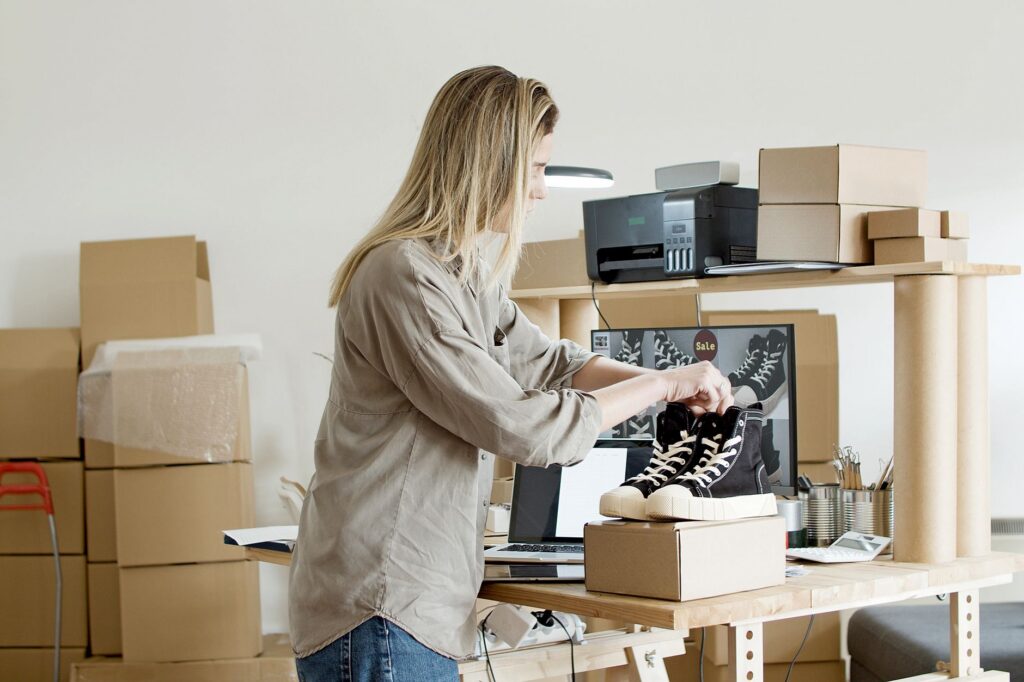 Bakery owner reviewing holiday order costs at the counter