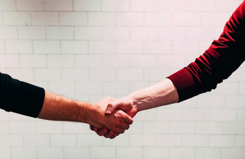 Handshake closing a negotiated business settlement