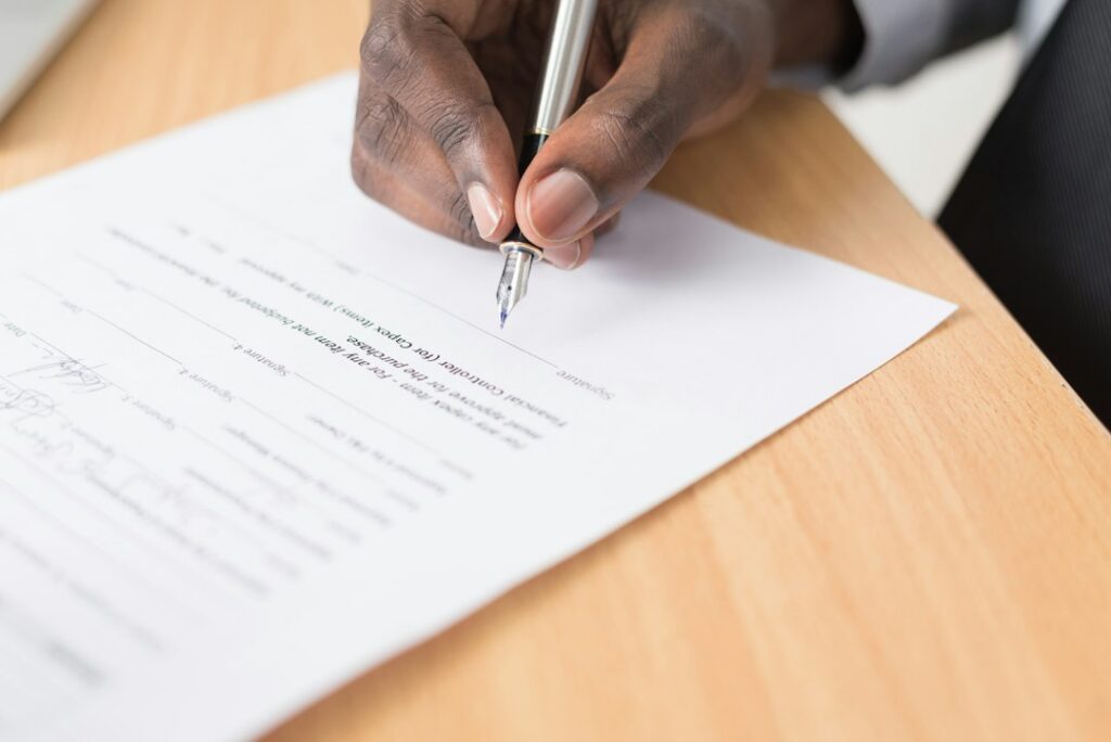 Close-up of a merchant cash advance contract's default and remedies clause