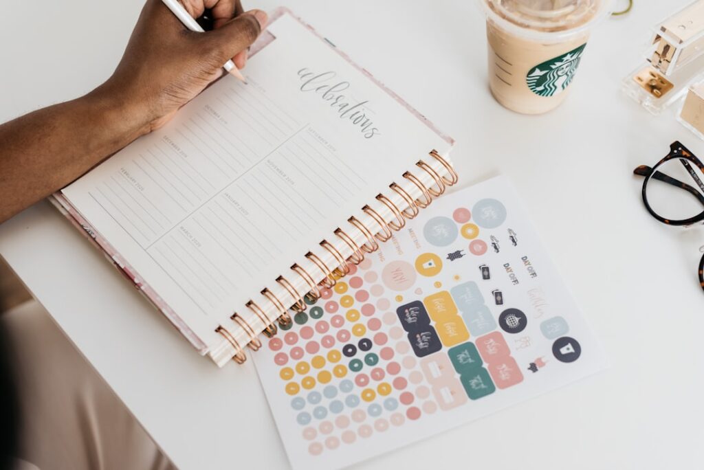 Small business owner planning seasonal hiring while reviewing paperwork at a desk