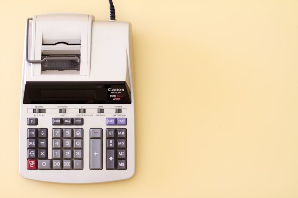 Bank statement and calculator on a desk