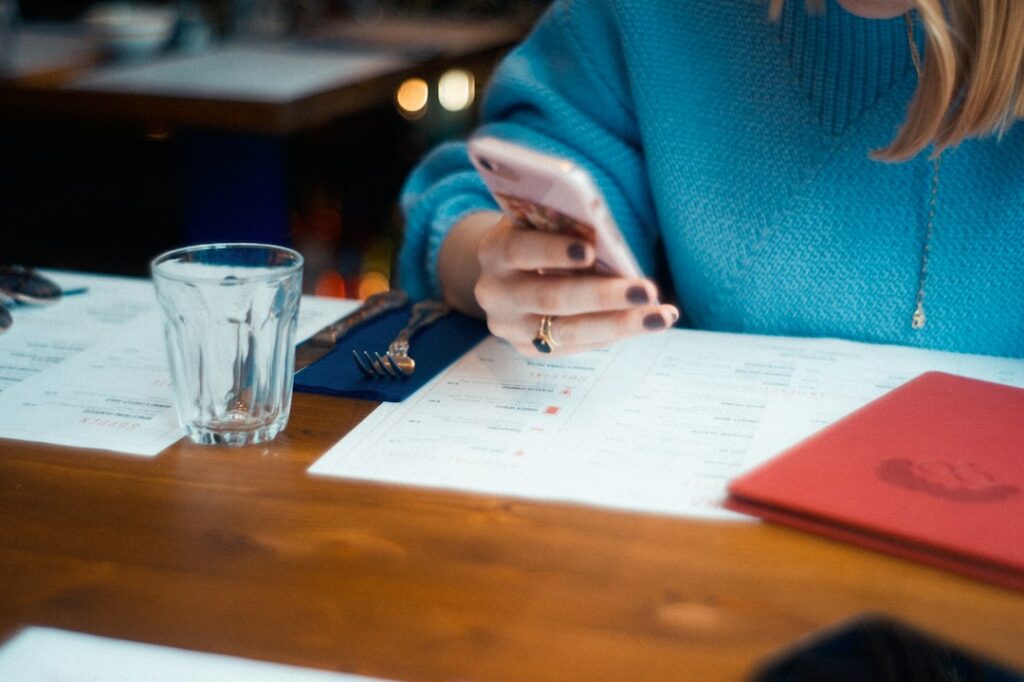 Business owner reviewing invoices and bank statements at a desk