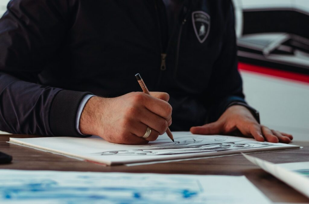 Close-up of a business contract being signed at a desk
