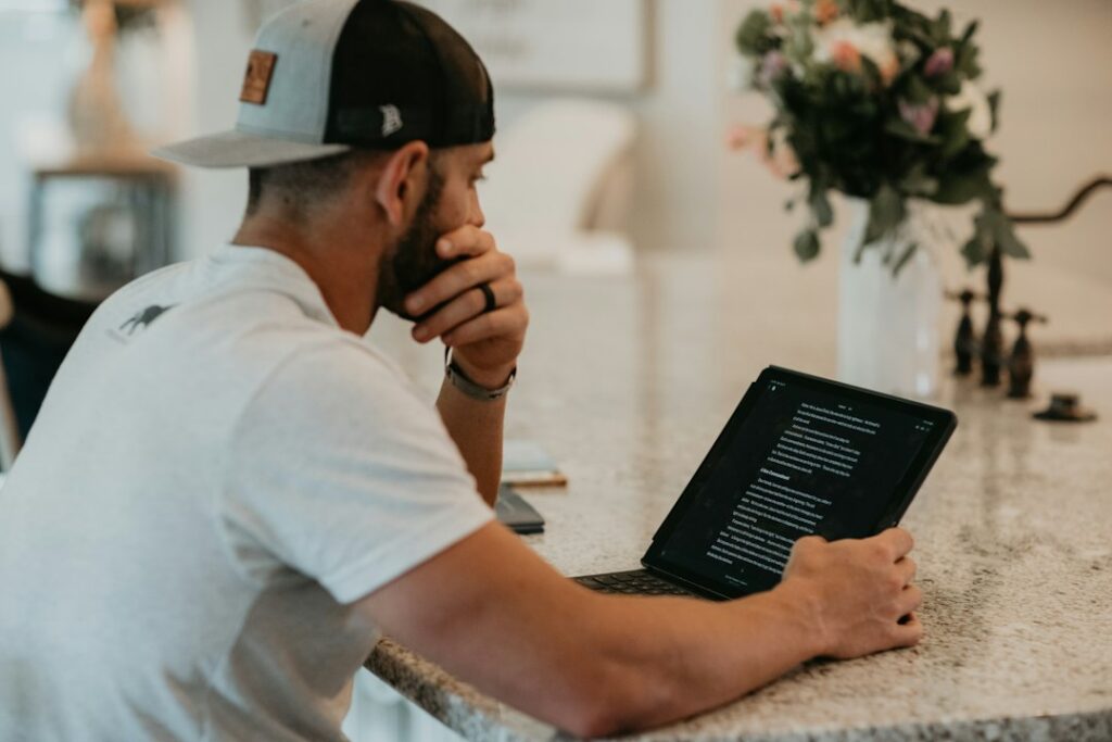 Ghost kitchen owner managing multiple delivery app tablets