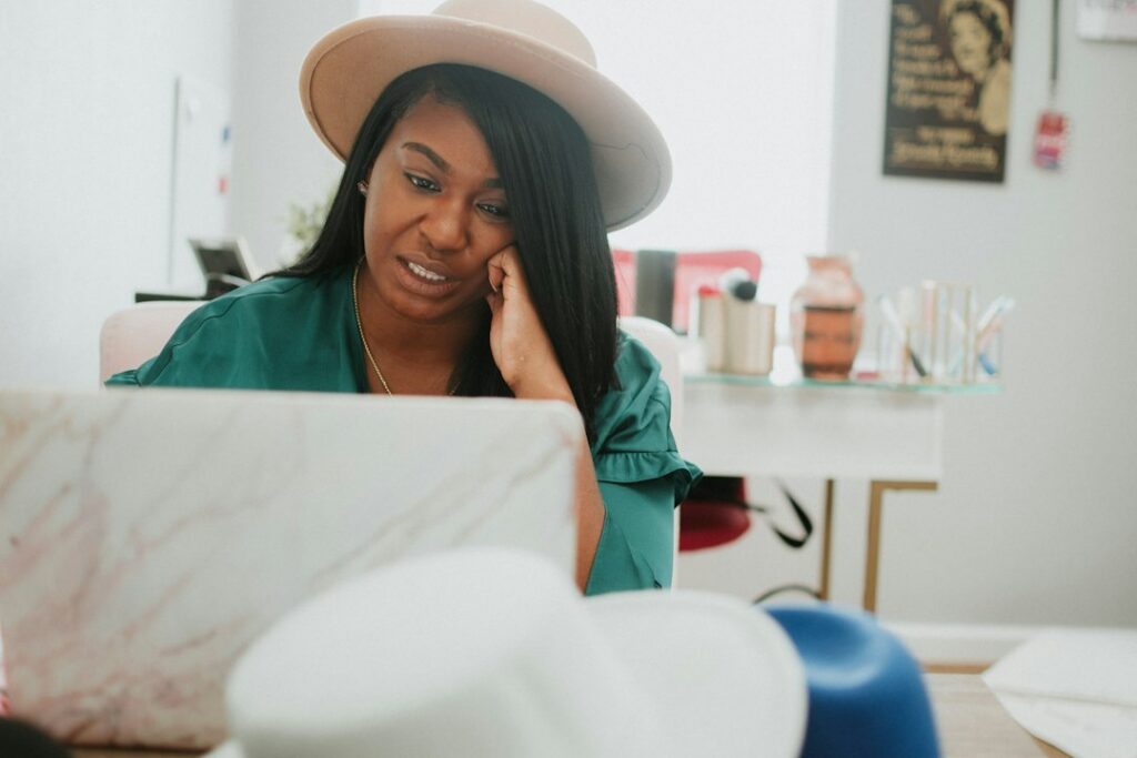 Small business owner smiling during a phone call in the office