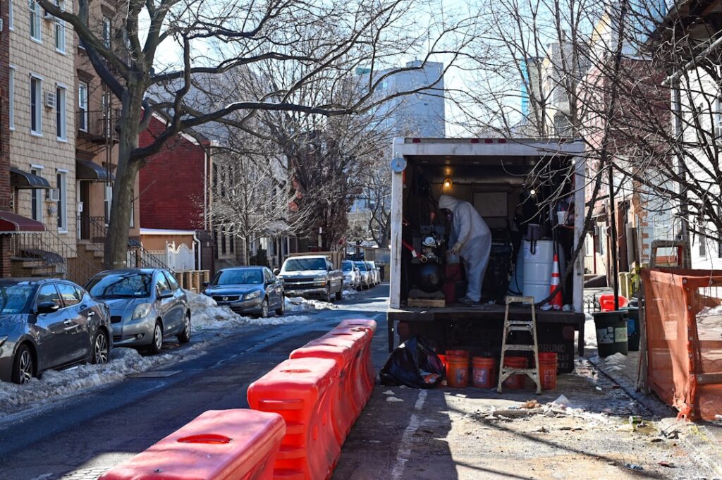 Delivery truck loaded with folding tables and chairs outside an event rental warehouse